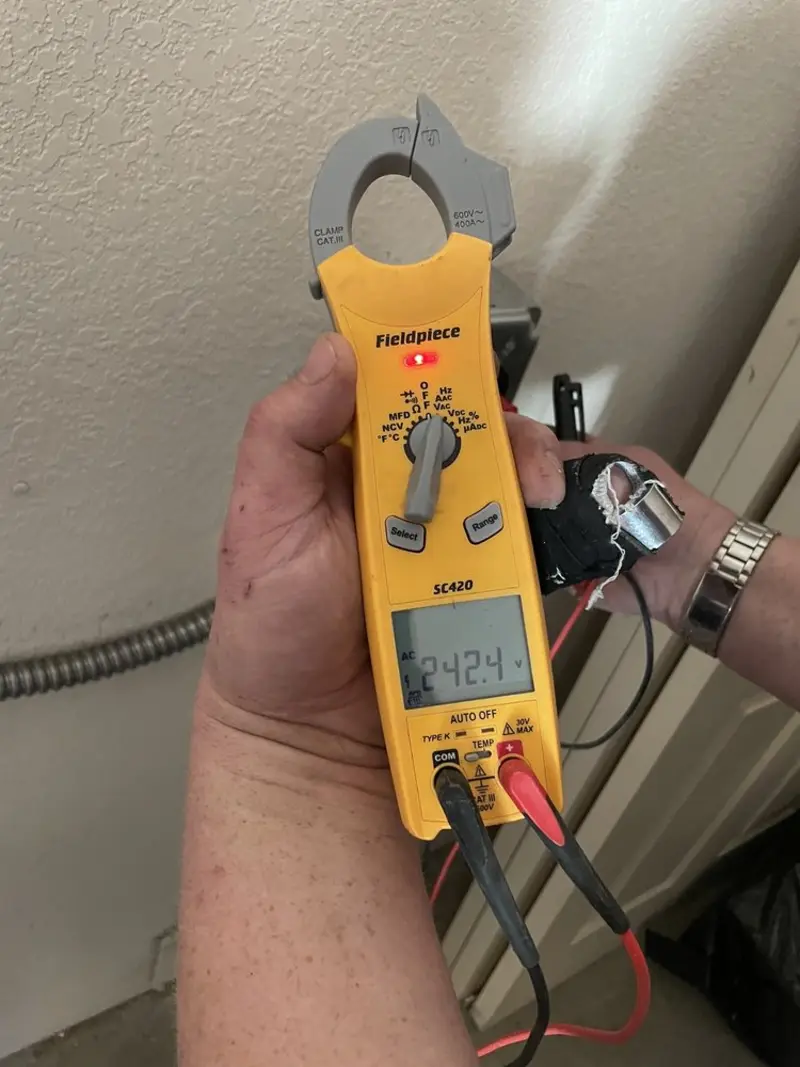 Voltage testing with clamp meter during Ceiling Fan Installation in Erlanger
